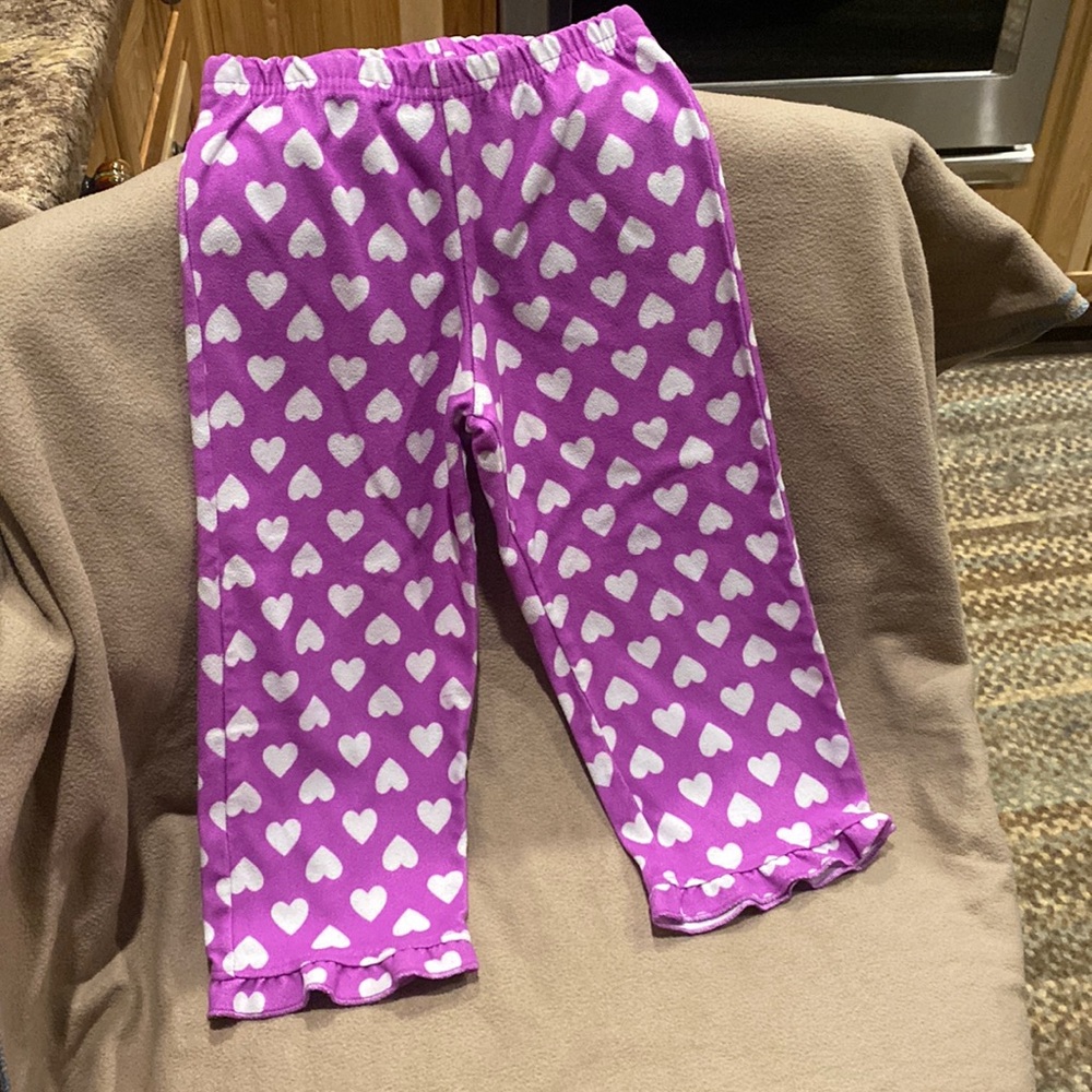 Purple pants with white hearts